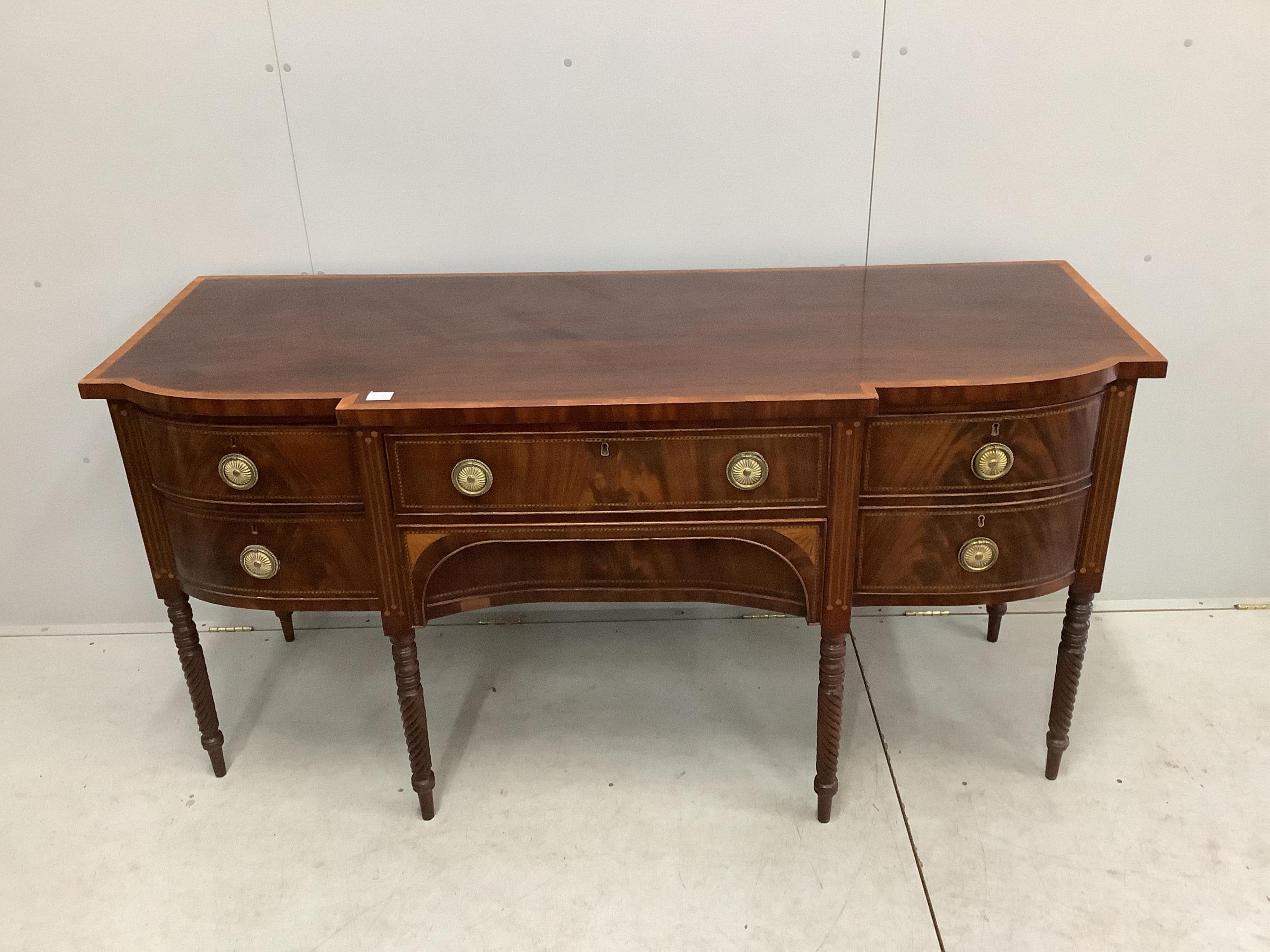 A George IV satinwood banded mahogany breakfront sideboard, width 184cm, depth 70cm, height 92cm. Condition - good